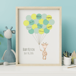 Framed giraffe signature balloon guest book displayed in a baby boy’s nursery with soft blue decor