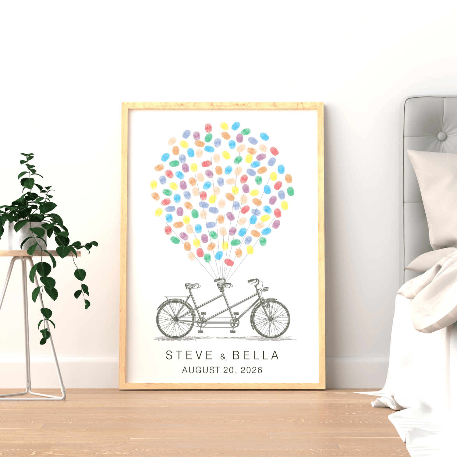 Framed tandem bicycle fingerprint guest book displayed on wall, personalized wedding gift keepsake.