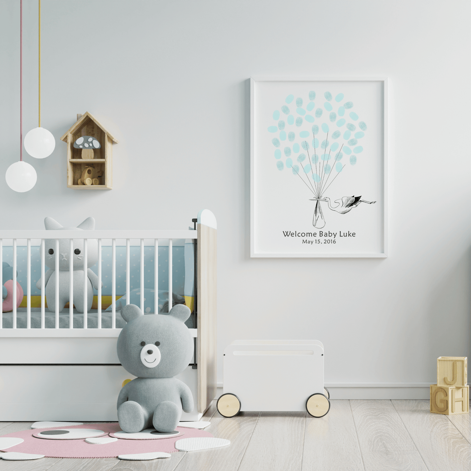 Personalized gender reveal guest book showing a stork holding a baby and colorful fingerprint balloons, keepsake for baby celebrations