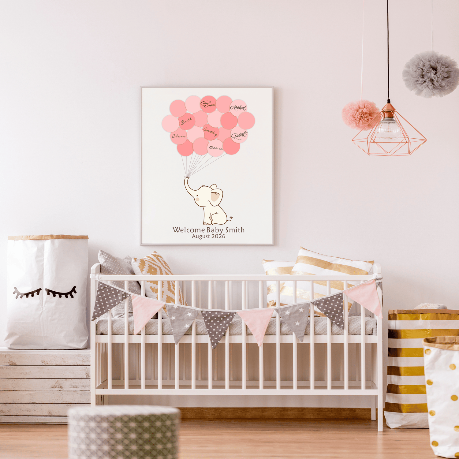 Framed pink elephant baby shower guest book with signature balloons, displayed on a nursery wall above a crib with matching pink decor.