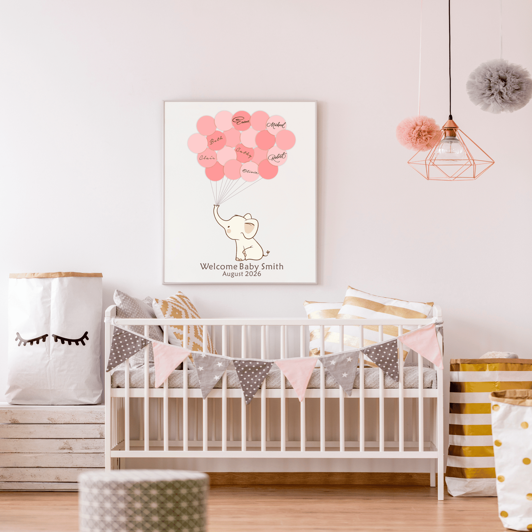 Framed pink elephant baby shower guest book with signature balloons, displayed on a nursery wall above a crib with matching pink decor.