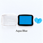 Aqua blue fingerprint guest book ink pad beside a heart-shaped sample print