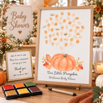 Orange pumpkin balloon fingerprint guest book displayed at a baby shower