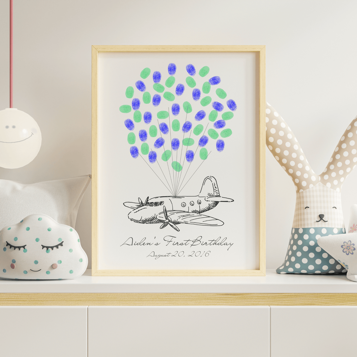 Adventure-themed airplane guest book where guests add fingerprint balloons – perfect keepsake for farewell, graduation, baby shower, or milestone celebration.