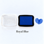 Royal blue fingerprint guest book ink pad beside a heart-shaped sample print