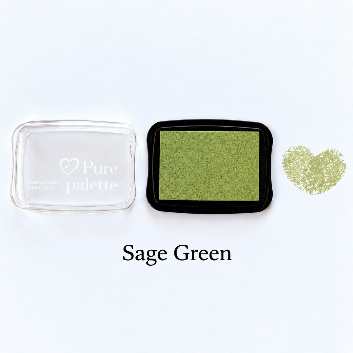 Sage green fingerprint guest book ink pad beside a heart-shaped sample print