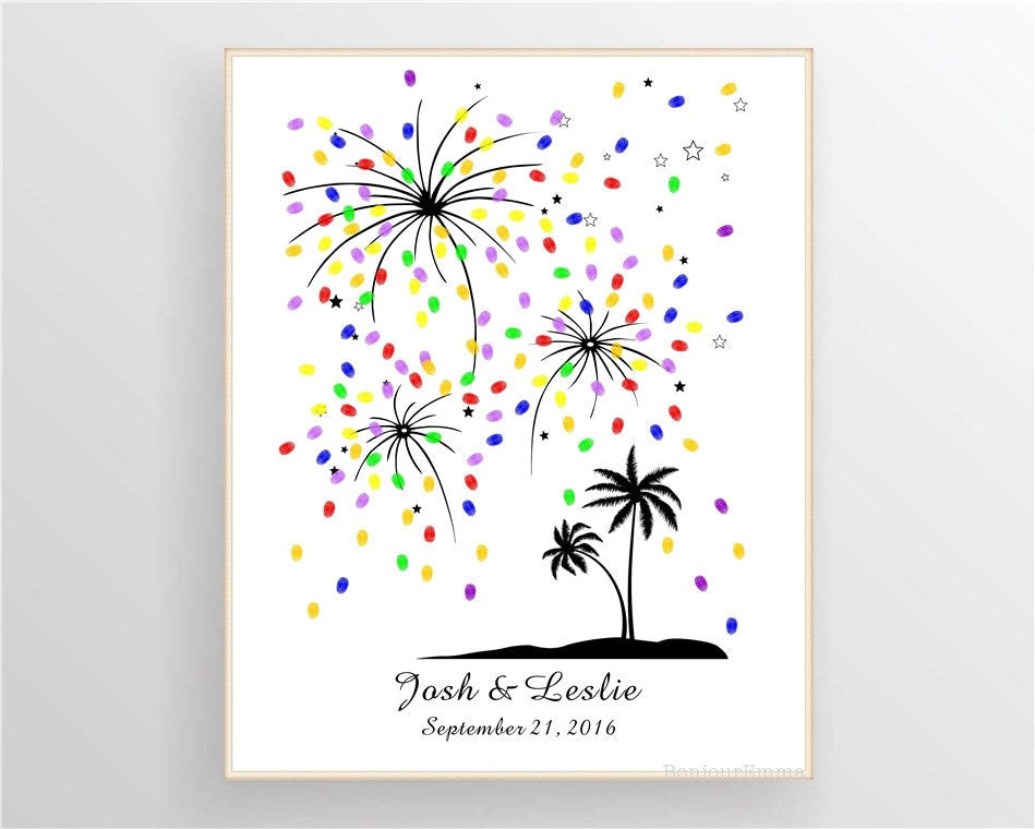 Beach wedding guest book alternative featuring palm trees and colorful fingerprint fireworks.