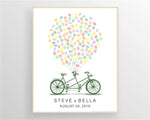 Framed tandem bicycle fingerprint guest book displayed on wall, personalized wedding gift keepsake.