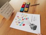 Demo showing guests adding fingerprints to an Up house balloon guest book